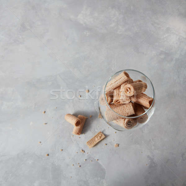 A glass with wafer creamy rolls - desserts for coctail, a on a g Stock photo © artjazz