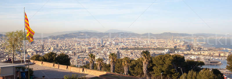 Aerial view of Barcelona city with flag Stock photo © artjazz