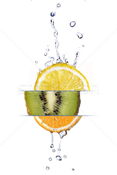 mix from lemon, orange and kiwi with fresh water drops isolated on white Stock photo © artjazz