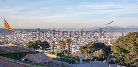 Aerial view of Barcelona city with flag Stock photo © artjazz