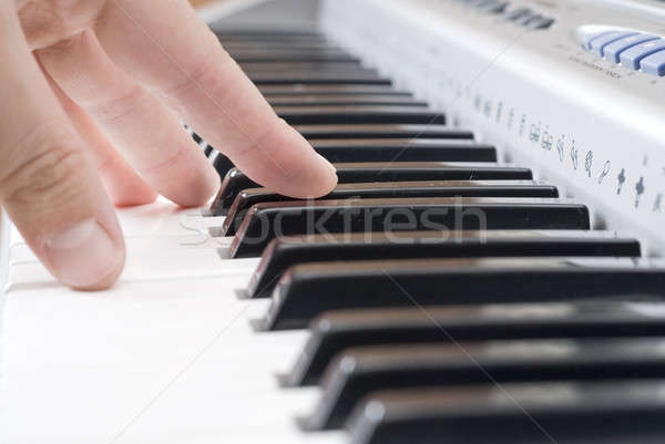 hand playing music on the piano Stock photo © artjazz