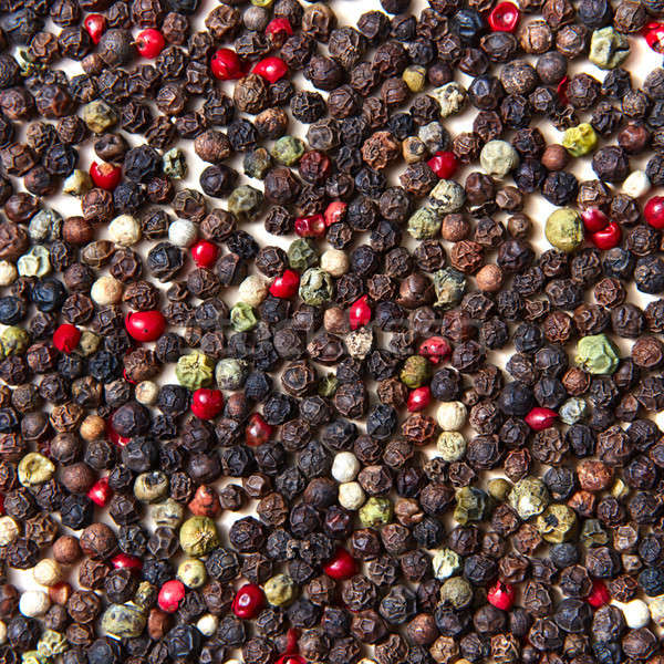 Close-up of colorful natural background from fragrant spices various kinds of pepper. Stock photo © artjazz