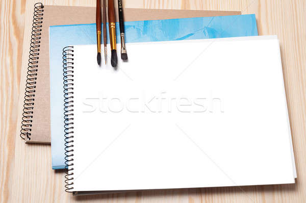 Notebooks and brushes Stock photo © Artspace