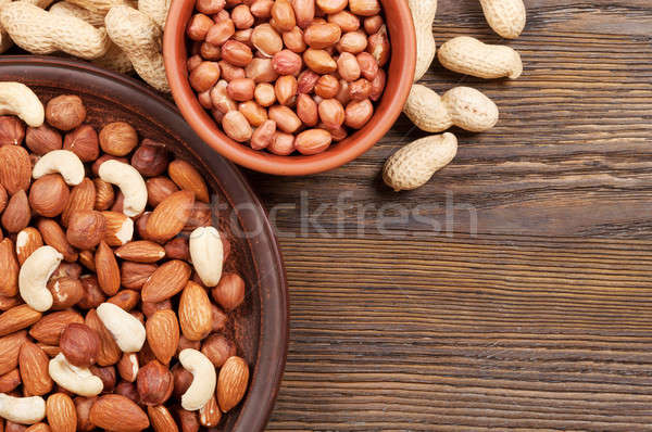 Different nuts in plates Stock photo © Artspace