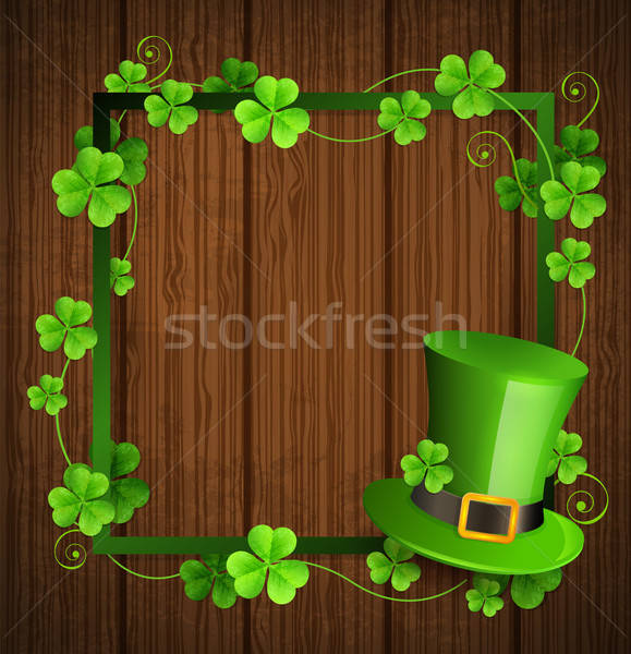 Сlover leaves and green hat on a wooden background. Stock photo © Artspace