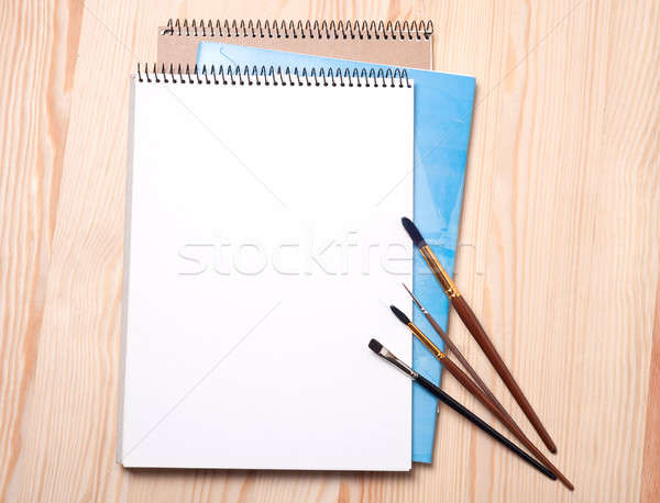 Blank notebook and brushes Stock photo © Artspace
