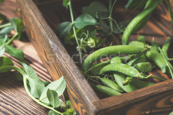 Stock photo: Pods of green peas and pea on dark wooden surface