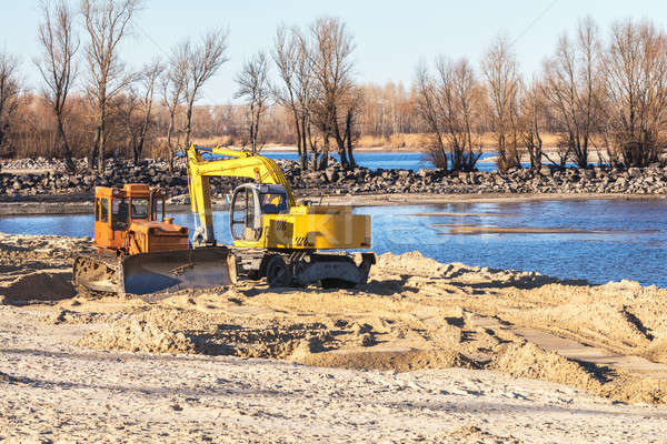 Excavator or digger and excavators working on ground. Industrial Stock photo © artsvitlyna