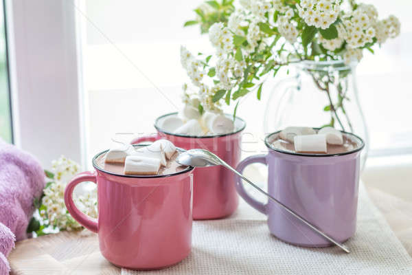 Marshmallows on top of hot cocoa in pink cups Stock photo © artsvitlyna