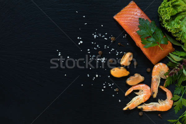 Preparing fresh seafood in the kitchen Stock photo © artsvitlyna