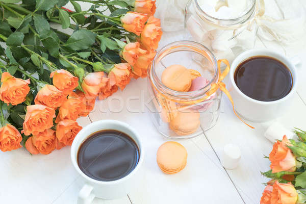 Arancione Cup caffè fresche rose mango Foto d'archivio © artsvitlyna