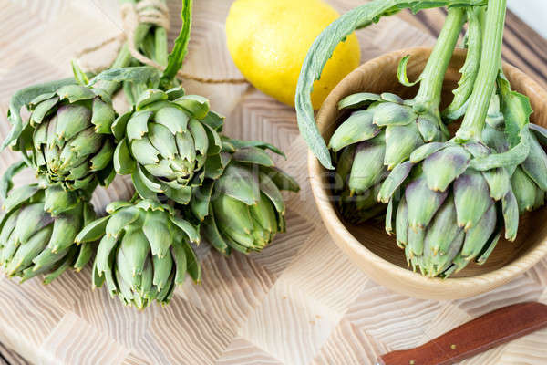 Artichoke bouquets on kitchen table Stock photo © artsvitlyna