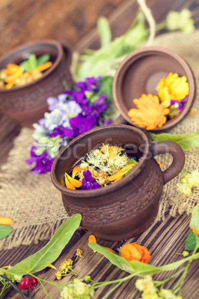 Ceramic cups of healthy herbal tea Stock photo © artsvitlyna