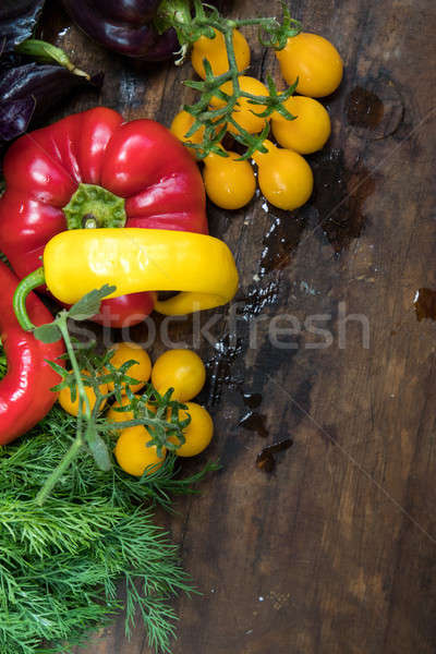 Red and purple sweet pepper and yellow tomatoes Stock photo © artsvitlyna