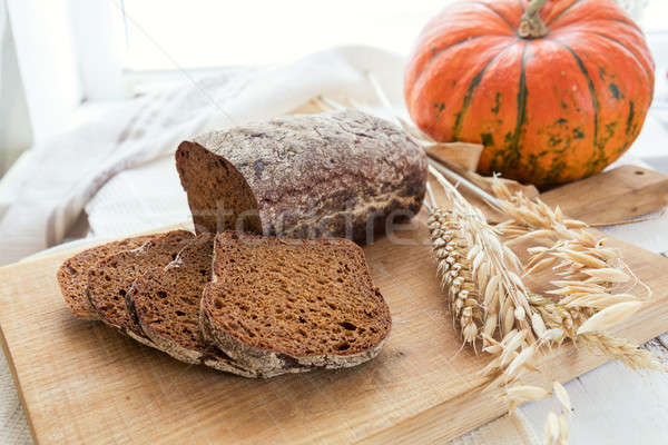 Freshly baked breads with ears and pumpkin Stock photo © artsvitlyna