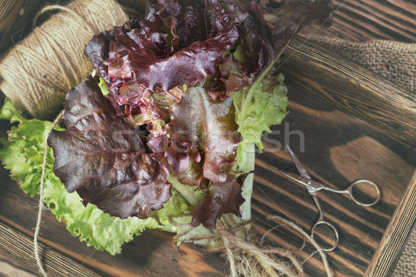  Bunch of lettuce in a wooden box Stock photo © artsvitlyna