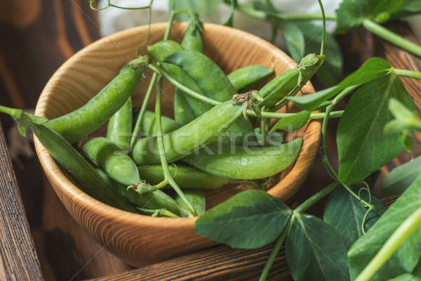 Stock photo: Pods of green peas and pea on dark wooden surface