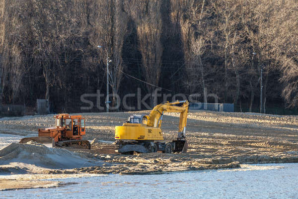 Excavator or digger and excavators working on ground. Industrial Stock photo © artsvitlyna