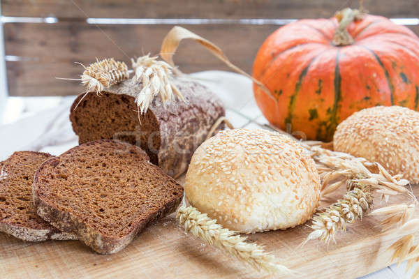 Freshly baked breads with ears and pumpkin Stock photo © artsvitlyna