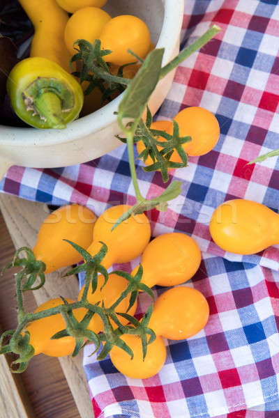 Yellow hot pepper and yellow tomatoes with purple basil Stock photo © artsvitlyna