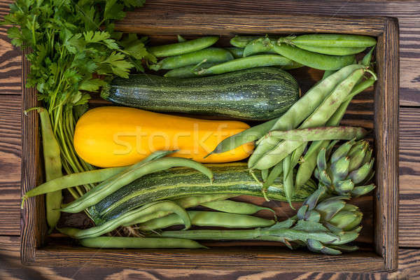 Stock photo: Fresh organic green vegetables on wooden floor 