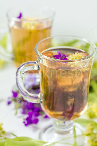 Hárs gyógynövény tea átlátszó üveg virág köteg Stock fotó © artsvitlyna