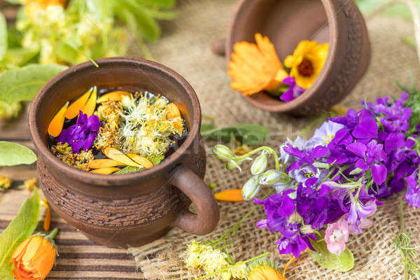 Ceramic cups of healthy herbal tea Stock photo © artsvitlyna