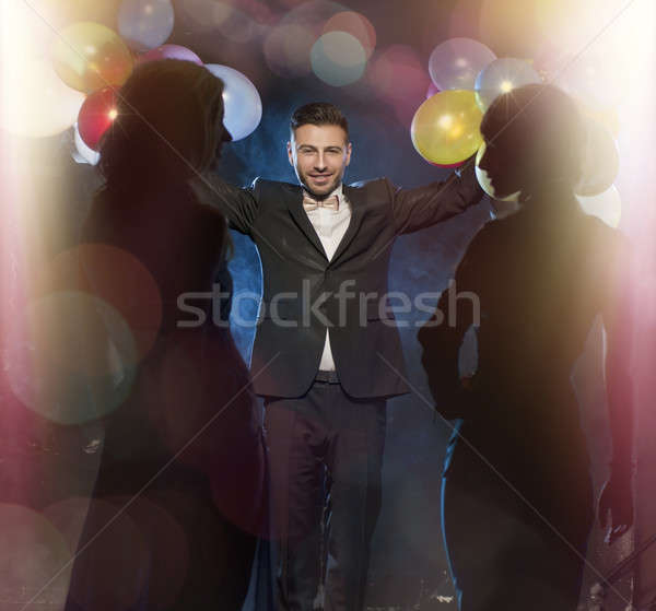 Happy young people celebrating new year's eve Stock photo © arturkurjan