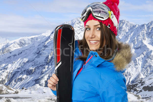 Beauty smiling woman in winter in mountains Stock photo © arturkurjan