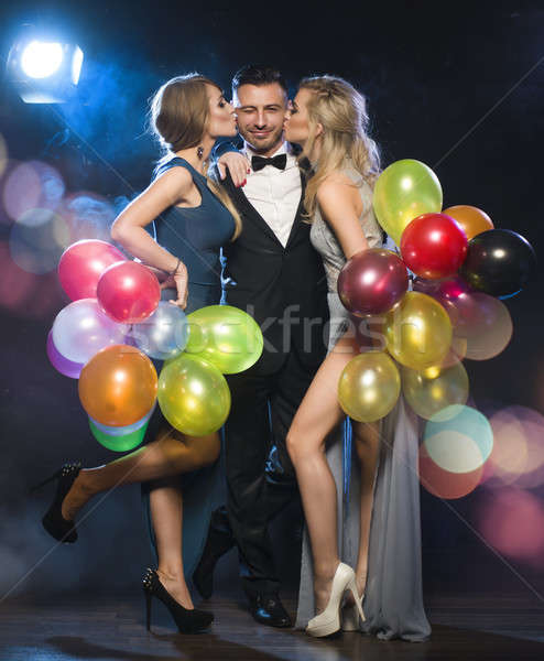 Happy young people celebrating new year's eve Stock photo © arturkurjan