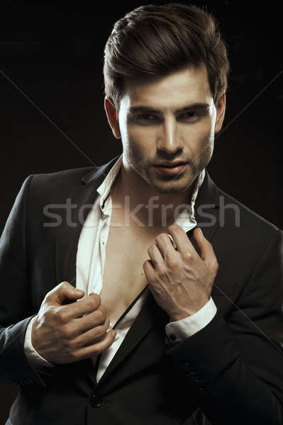 Portrait of handsome stylish man in elegant suit Stock photo © arturkurjan