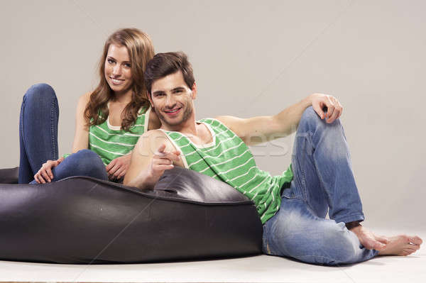 Portrait of smiling young couple at home Stock photo © arturkurjan