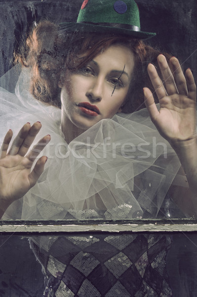 Triste donna dietro vetro solitaria faccia Foto d'archivio © arturkurjan
