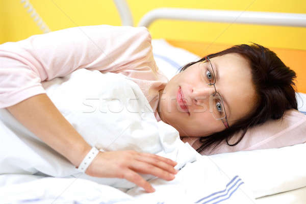 smiling middle-aged woman lying in hospital Stock photo © artush