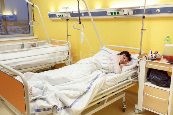 sad middle-aged woman lying in hospital Stock photo © artush