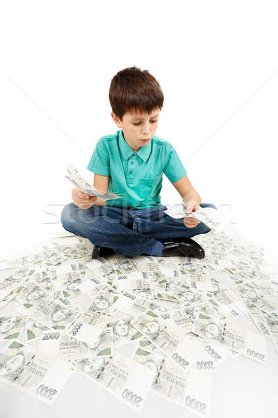 boy sitting on money Stock photo © artush