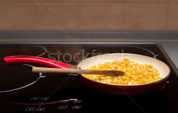 cooking sweet conn with wooden spoon Stock photo © artush