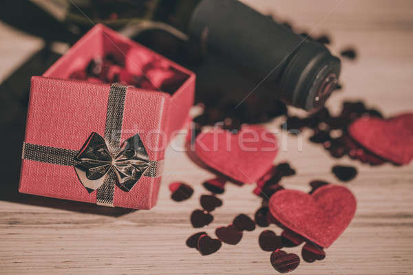 bottle of vine, red hearts and small present a retro style Stock photo © artush