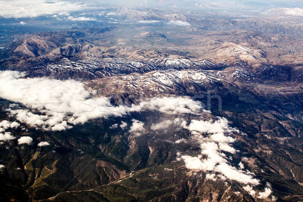 Kilátás hegyek repülőgép repülőgép fölött felhők Stock fotó © artush