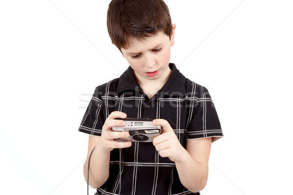 small boy checking analog camera settings Stock photo © artush