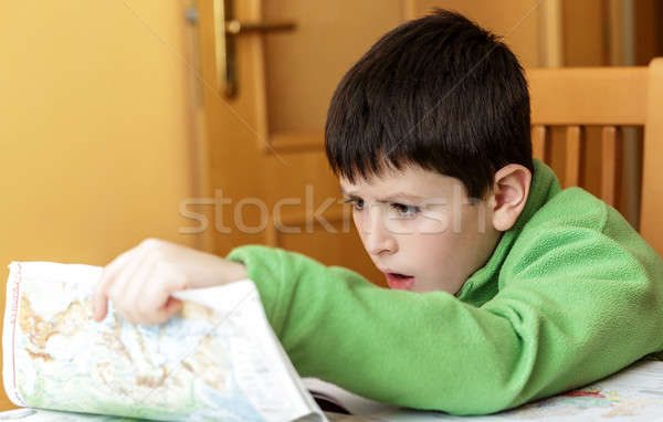bored and tired boy doing homework Stock photo © artush