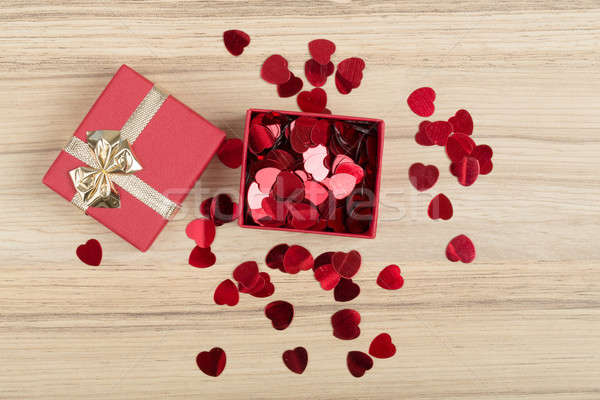 Stock photo: Red hearts confetti on wooden background