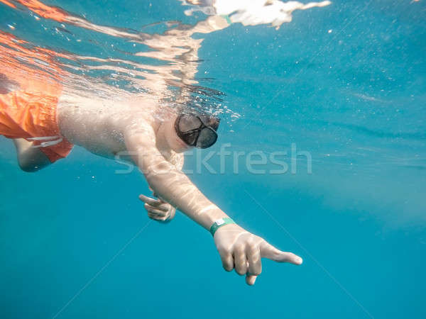 Young boy Snorkel swim in coral reef Stock photo © artush
