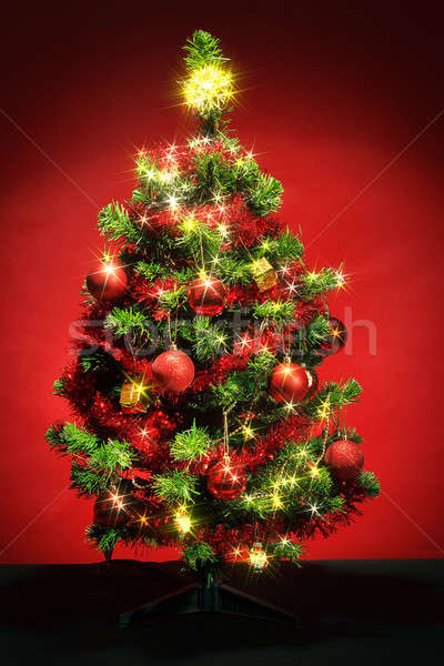 Decorated christmas tree with stars on red background Stock photo © artush