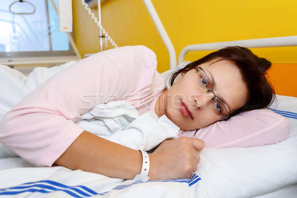 sad middle-aged woman lying in hospital Stock photo © artush