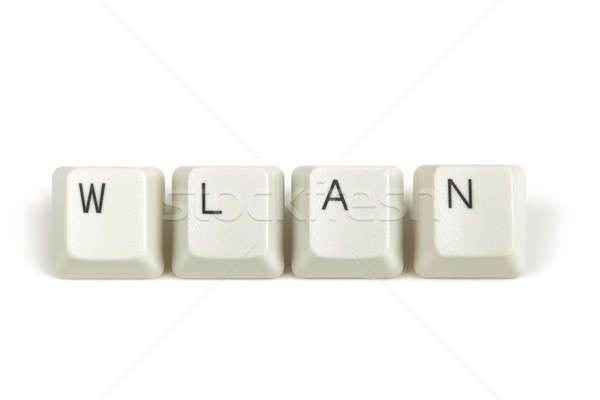 wlan from scattered keyboard keys on white Stock photo © artush