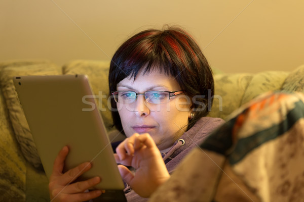 woman reading news on tablet Stock photo © artush