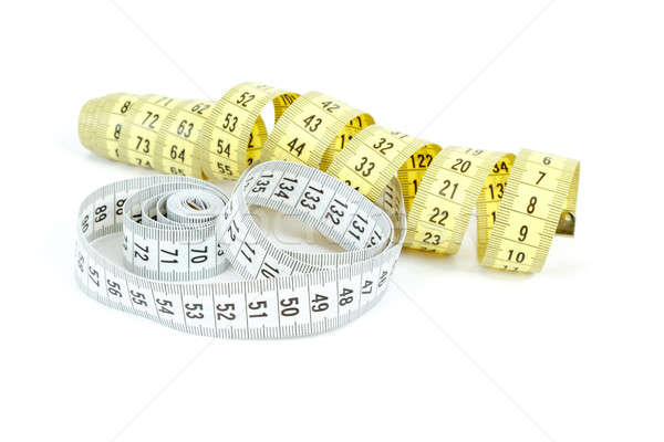 Yellow and white measuring tape isolated on white Stock photo © artush
