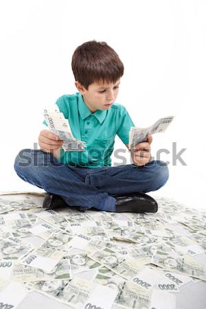 boy sitting on money, money concept Stock photo © artush