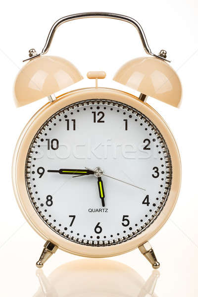 Stock photo: Alarm clock on a table